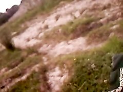 Рыжая немка с маленькими сиськами на природе в видео делает минет от первого лица